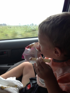 Yes.. he is eating a paddle pop.  Bribery again at its best! 